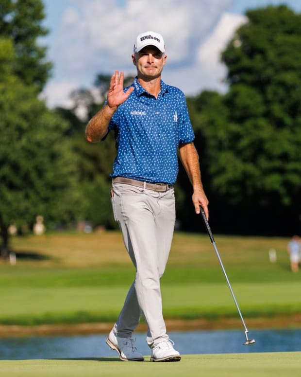 Jul 10, 2022; Nicholasville, Kentucky, USA; Kevin Streelman waves to the crowd on the 18th green during the final round of the Barbasol Championship golf tournament. Mandatory Credit: Jordan Prather-USA TODAY Sports